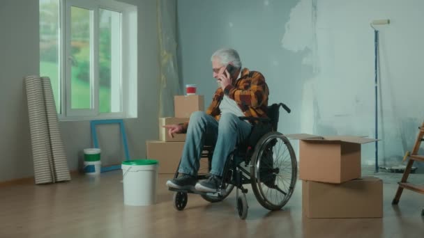 Elderly Disabled Man Moves Wheelchair Talks Mobile Phone Pensioner Takes — Vídeos de Stock