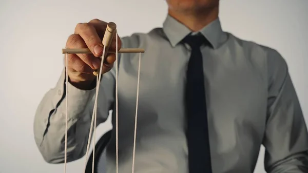 Businessman Gray Shirt Black Tie Controls Puppet Wooden Manipulator Strings — Fotografia de Stock