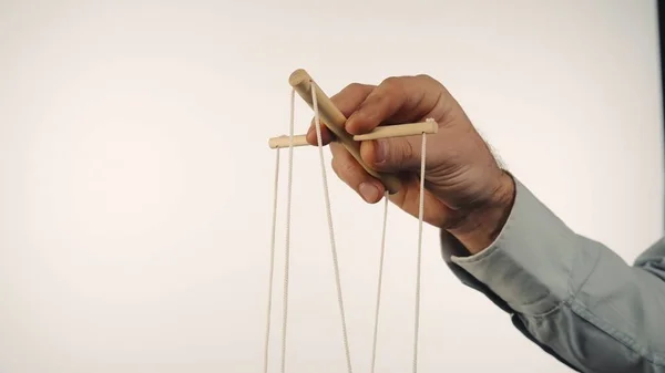 Hand Man Gray Shirt Controls Puppet Using Wooden Manipulator Strings — Stock Photo, Image