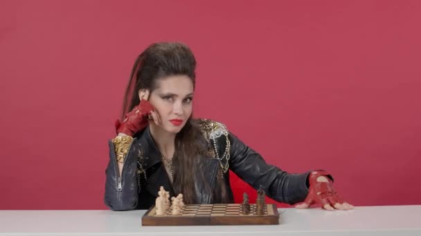 Woman Sits Table Front Chess Set Looks Straight Ahead Woman — Stock Video