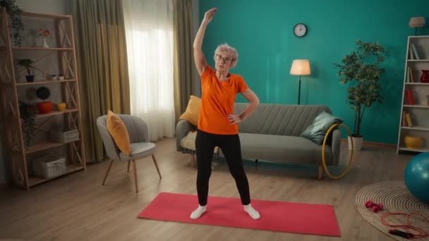 Grayhaired Retired Woman Does Warmup Training Woman Bends Side Concept — Stock Video