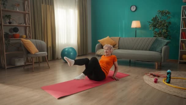 Retired Woman Lying Sports Mat Performs Bicycle Exercise Grayhaired Elderly — Stock Video