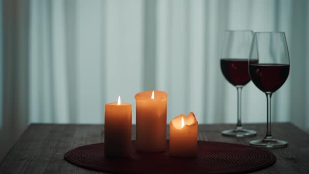Man Blows Out Candles Table Next Glasses Wine Leaves Room — Stock Video