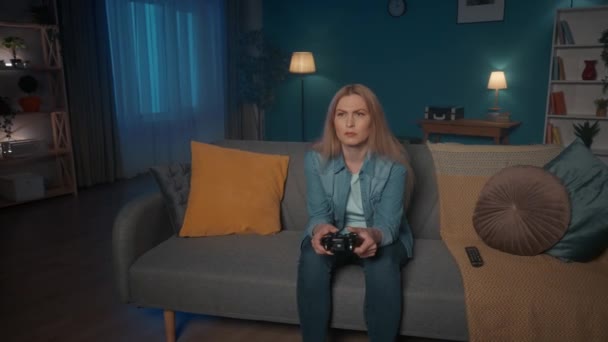 Woman Plays Consular Game Game Controller While Sitting Couch Home — Stock Video