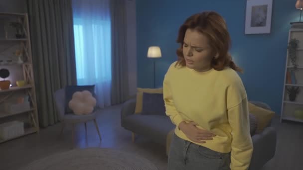 Woman Holds Her Hands Her Stomach Suffering Pain Standing Living — Videoclip de stoc