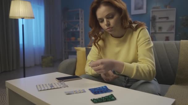Woman Sits Sofa Living Room Blisters Pills Lie Table Front — Stock Video