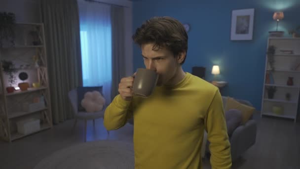 Man Adds Slice Lemon His Cup Tea Drinks Man Grimaces — стоковое видео