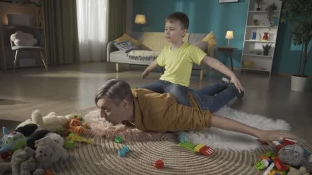 Young Father Son Living Room Dad Laying Floor Holding His — Stock Video