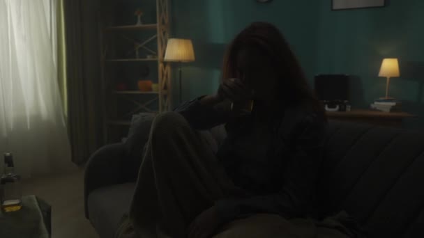 Woman Sits Room Dark Bottle Alcohol Table Close Disheveled Woman — Stock Video