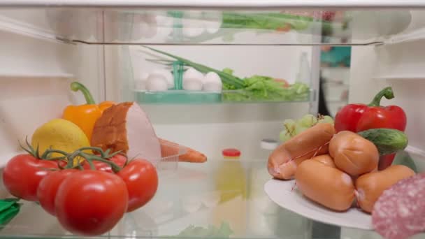 Asian Woman Opens Refrigerator Door Examines Its Contents Woman Chooses — Stock Video