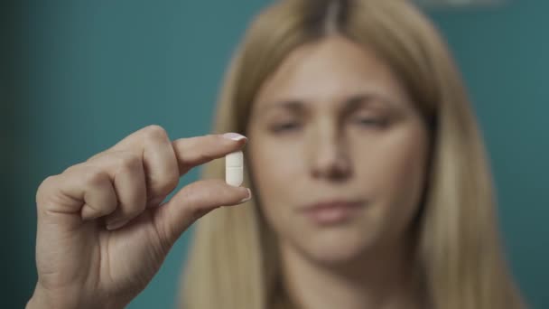 Portrait Blonde Woman Close Shot Female Model Holding Pill Her — Stock Video