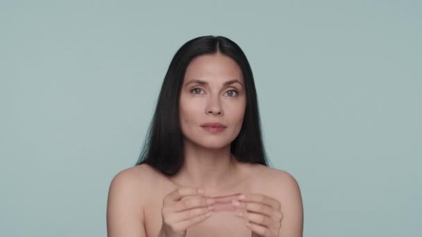 Brunette Woman Doing Facial Skin Care Procedures Woman Applies Red — Stock Video