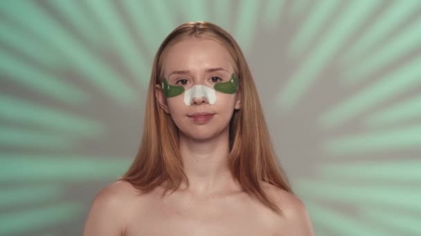 Young Woman Smoothes Green Hydrogel Patches Her Eyes Woman Patches — Stock Video