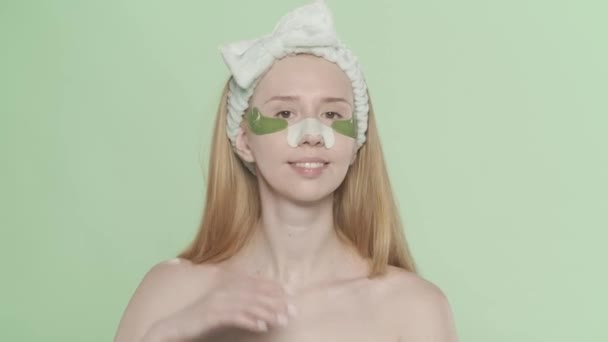 Woman Patches Her Eyes Plaster Blackheads Her Nose Green Screen — Stock Video