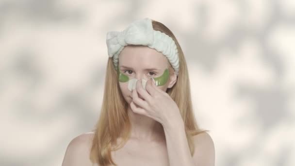 Woman Removes Patches Her Eyes Runs Her Fingers Clean Moisturized — Stock Video