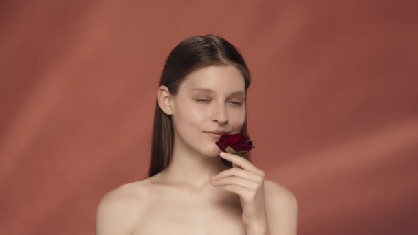 Woman Inhales Scent Red Rose Touches Perfect Skin Her Face — Stock Video
