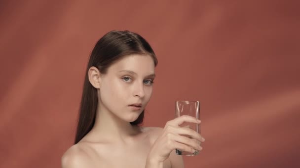 Young Woman Drinks Clean Clear Water Glass Seminude Woman Studio — Stock Video