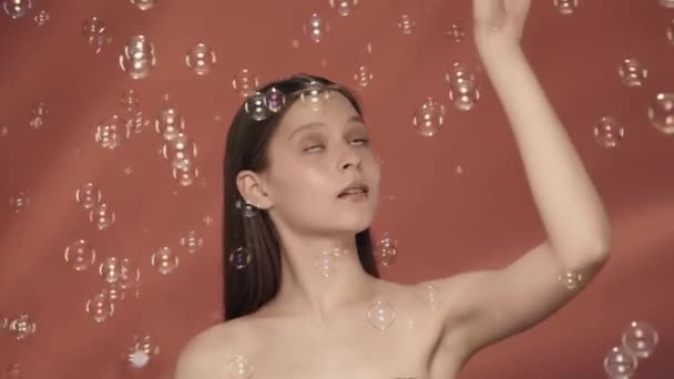 Woman Having Fun Soap Bubbles Catching Them Seminude Woman Studio — Stock Video