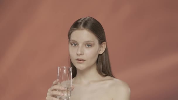 Young Woman Drinks Clean Clear Water Glass Seminude Woman Studio — Stock Video