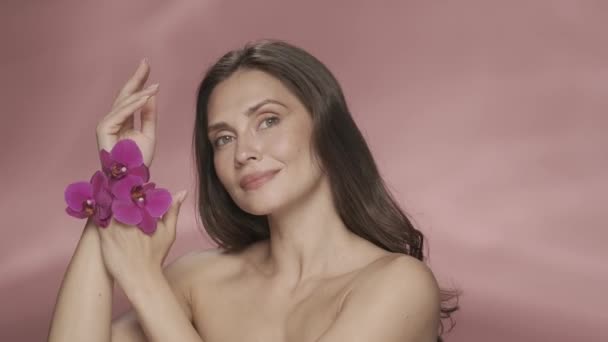 Woman Enjoys Velvety Softness Skin Her Hands Studio Pink Background Stock Footage