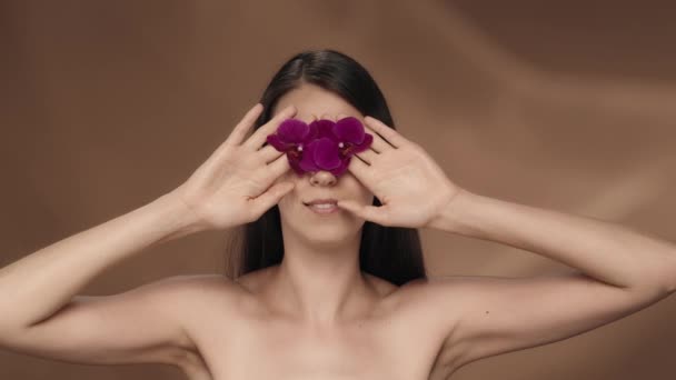 Woman Surprised Expression Delight Removes Her Hands Orchid Flowers Covered — Stock Video
