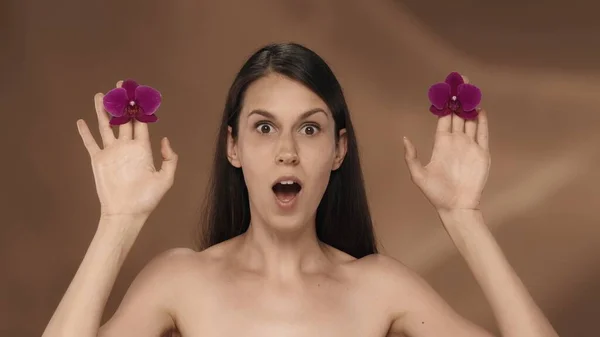Portrait Woman Surprised Expression Holding Orchid Buds Her Hands Woman — Stock Photo, Image