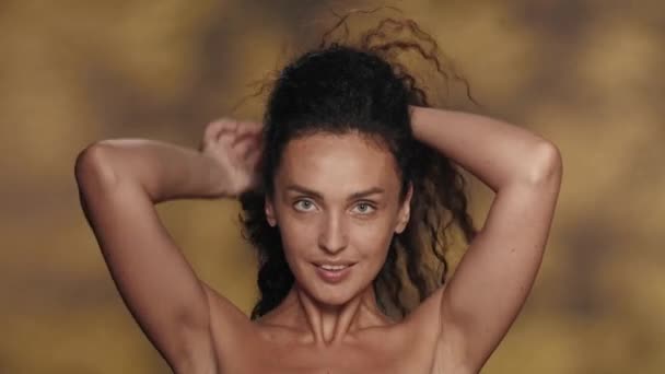 Brunette Woman Ties Twists Her Thick Long Curly Hair Bun — Stock Video