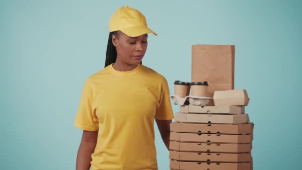Courier Service Concept Portrait Delivery Woman Yellow Cap Tshirt Offering — Stock Video