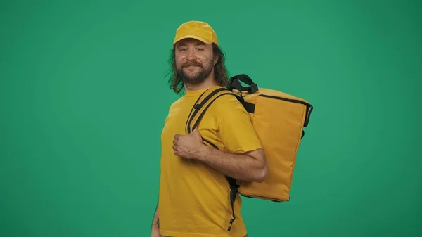 Portrait Smiling Delivery Man Yellow Cap Tshirt Holding Portable Backpack — Stock Photo, Image