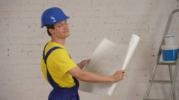 Medium Shot Smiling Young Construction Worker Holding Plan Building Man — Stock Photo, Image