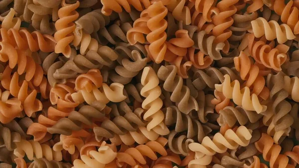 Primo Piano Colpo Molti Uncooked Colorato Pasta Spirali Sfondo Area — Foto Stock
