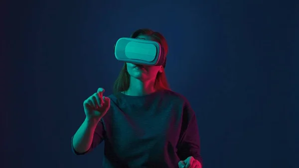 Young Woman Wearing Virtual Glasses Scrolls Invisible Screen Her Finger — Stock Photo, Image