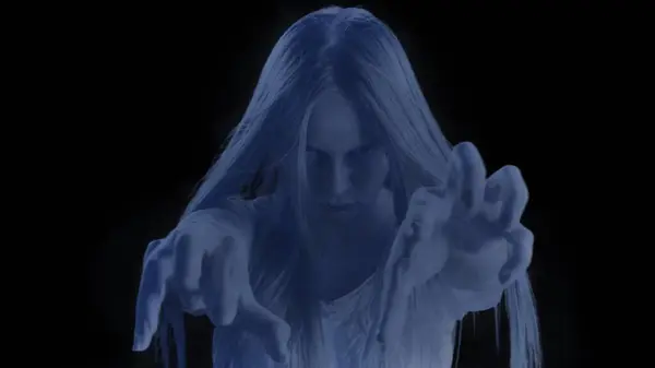 stock image Medium shot of a glowing female, woman figure, ghost, poltergeist pulling her hands out to the camera on a black background. Mock up to insert in your clip, advertisement. Horror, paranormal.