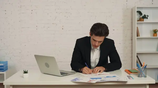 Medium Shot Young Man Sitting Office Studying Cheching Graphs Charts — Stock Photo, Image