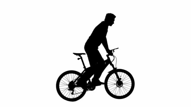 身着休闲装 站在白色背景阿尔法通道上的运动自行车上的人的黑色轮廓 骑自行车的男性骑手站在自行车上的画像 — 图库视频影像