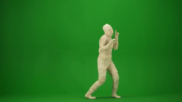 Mummy Wrapped Bandages Dances Raising His Arms Jumping Green Screen — Stock Video