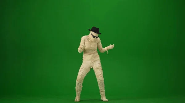 Scary Mummy Wrapped Bandages Dances Wearing Black Hat Sunglasses Green — Stock Photo, Image