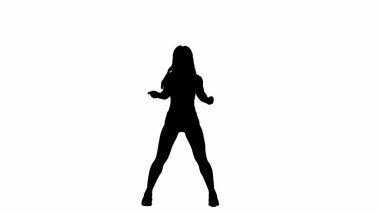 Beyaz bir arkaplanda, siluette ince bir kız duruyor. Dans hareketini twerk tarzında gösteriyor. Seksi, plastik, ritmik. Kameraya bakıyorum. Orta çerçeve.
