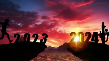 2024 no 'lu uçurumdan atlayan bir adam, gün batımında taşlarla birlikte. Yeni yıl konsepti. Hoş geldin 2024. İnsanlar 2024 yılına giriyor, yaratıcı fikir.