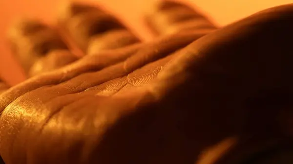 Detailed drawing of palm skin. Human closeup medicine skin. Healthy naked surface. Orange light.