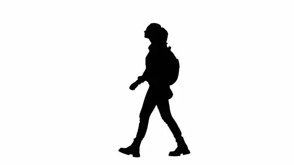 旅行创意机场广告的概念 在白色背景 通道上孤立的旅行者的肖像 戴眼镜 背着背包走来走去 环顾四周的女人的轮廓 — 图库照片