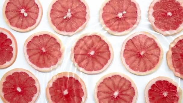 Scheibe Grapefruit Unter Wasser Oder Wasser Mit Spritzen Und Tropfen — Stockvideo