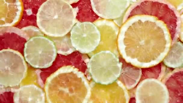 Snijd Van Citrusvruchten Onder Water Water Met Opspattend Druppelend Bovenaanzicht — Stockvideo