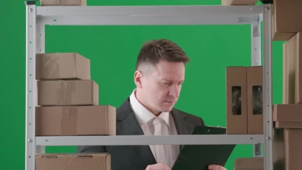 Frame Green Background Adult Man Suit Demonstrates Manager Director Warehouse — Stock Video