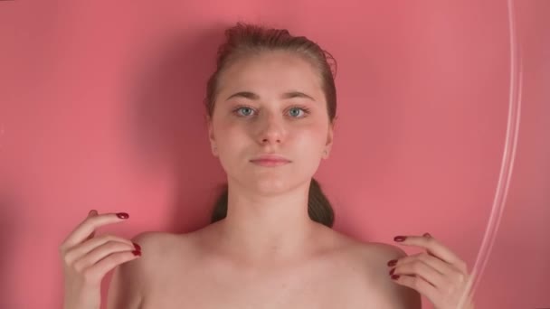 Pink Background Shows Attractive Girl Makeup She Lying Ostensibly Underwater — Stock Video