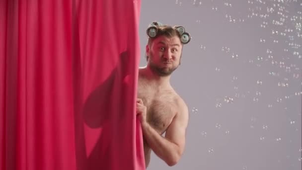 Man Fooling Shower Making Faces Man Curlers His Head Covered — Stock Video