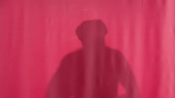 Silhouette Washing Man Pink Shower Curtain Pulled Back Curtain Man — Stock Video