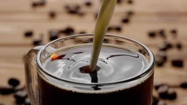 Stream Milk Pours Full Cup Coffee Dissolves Macro Shot Glass — Stock Video