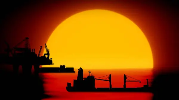 Modern technology of power industry creative advertisement concept. Shot of offshore oil platforms in the water over sun. Oilfields with cranes extracting crude oil in the sea, ships sailing around.