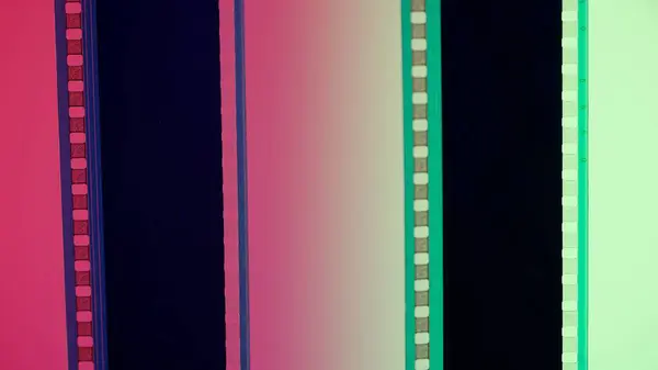 Two Vertical Film Strips Red Green Gradient Background Close 35Mm — Stock Photo, Image